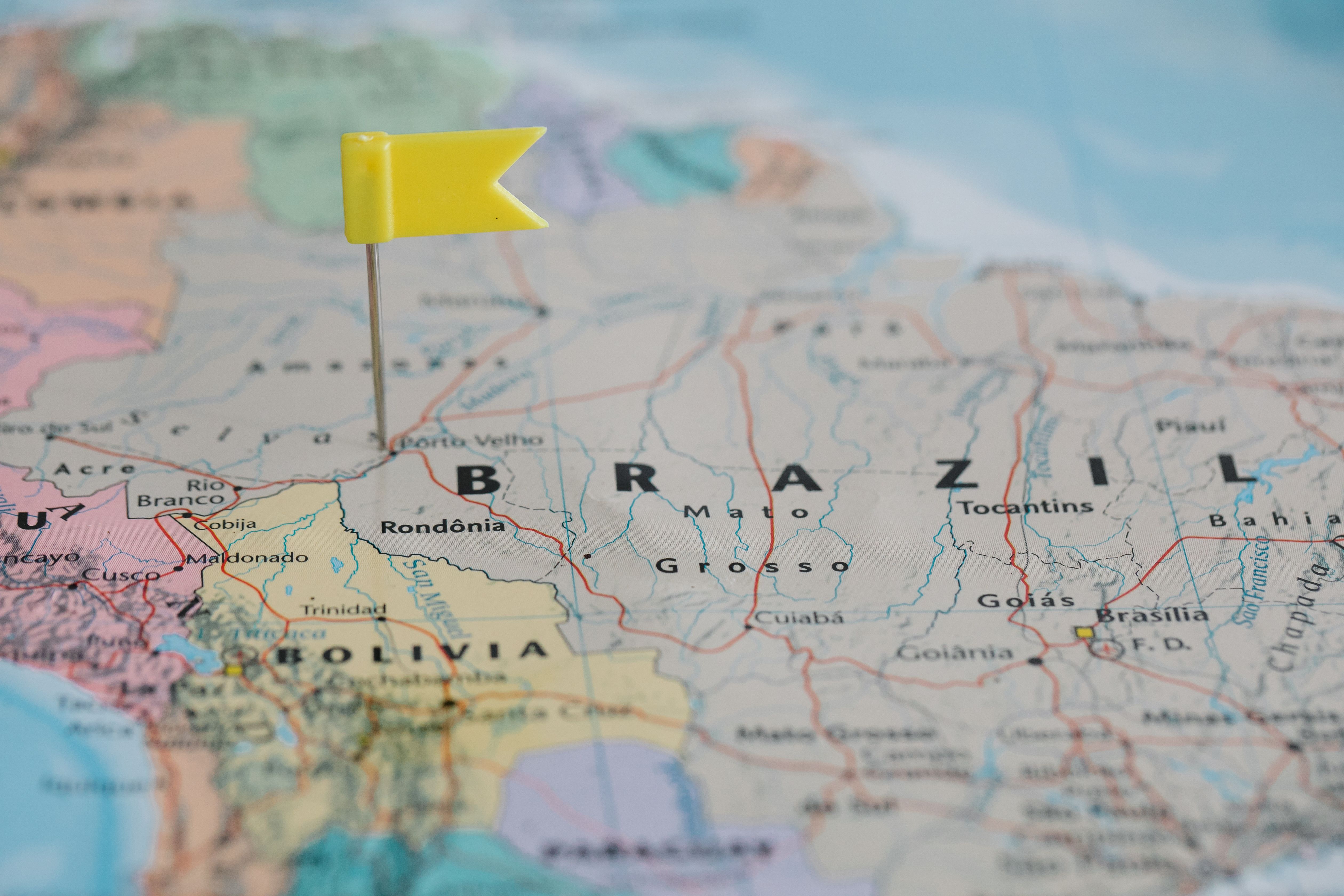 Close-up of a city map with a yellow pin marking a business location